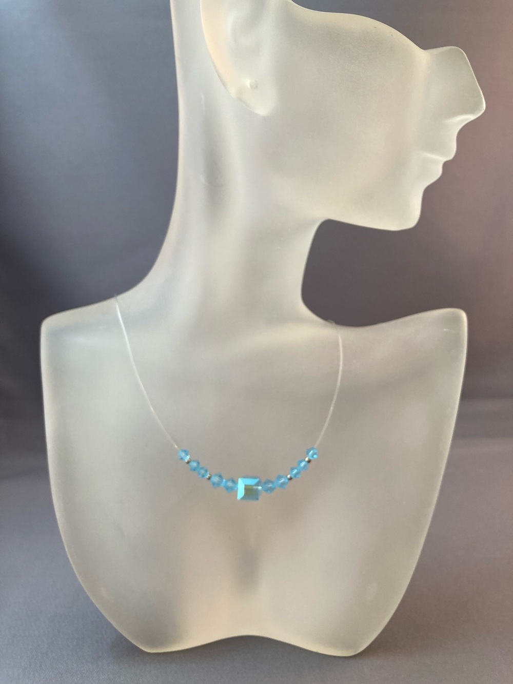 Light blue crystal bead necklace on monofilament 15 inches